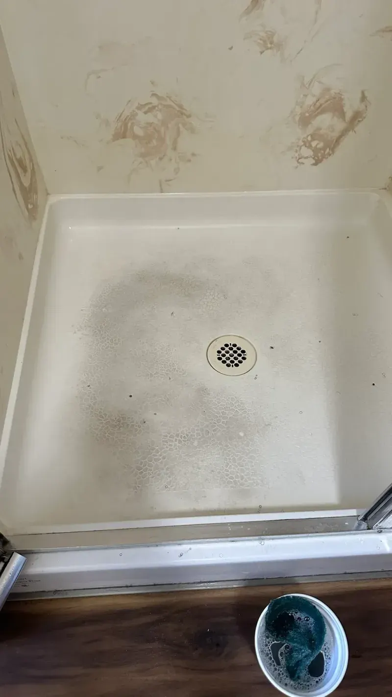 Before: the shower base, dirty