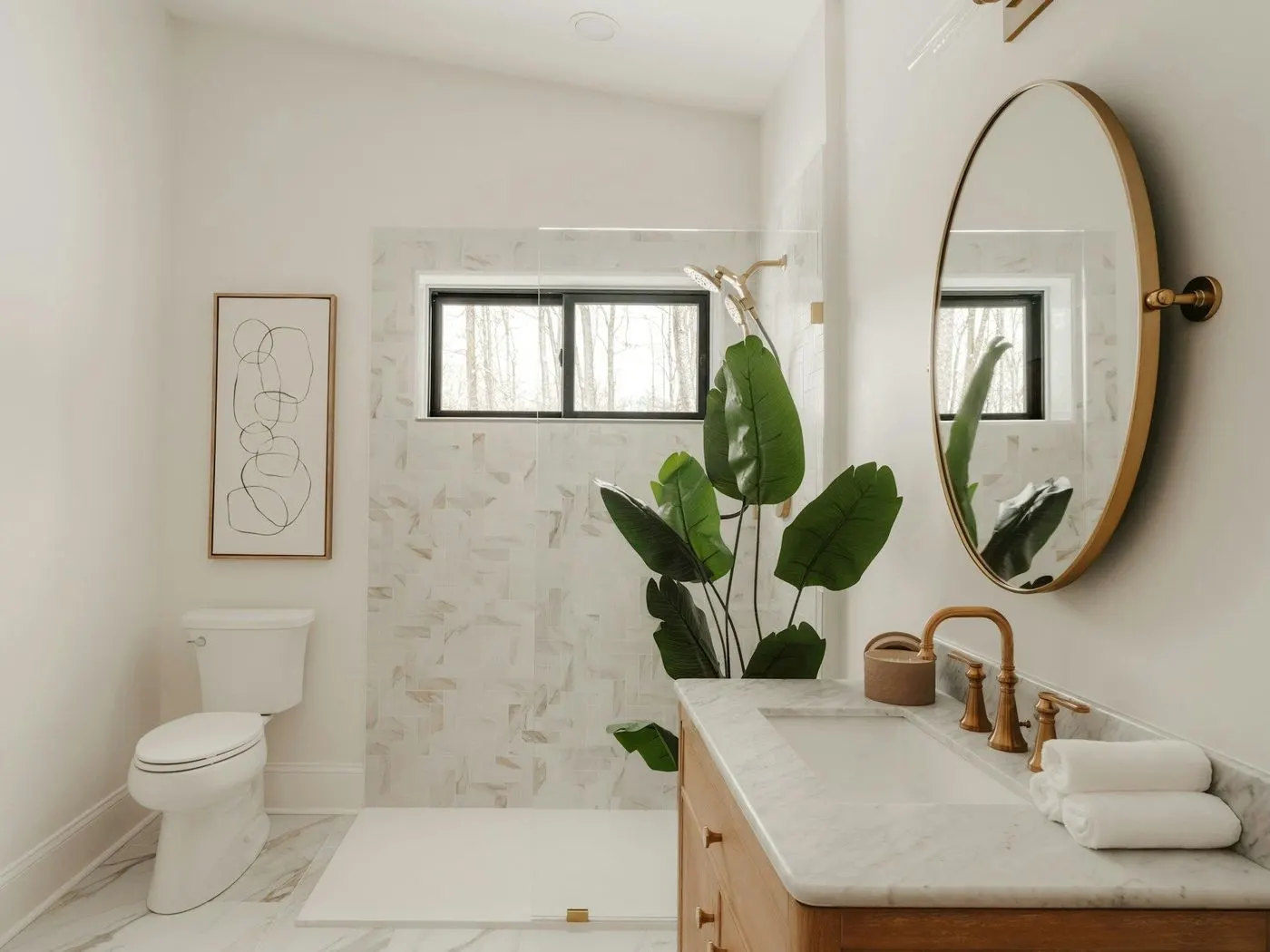 Bright bathroom with a round mirror and marble tile after a deep cleaning